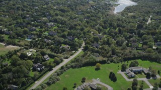 4K aerial stock footage of flying by upscale homes in Southampton, New York Aerial Stock Footage | AX91_210