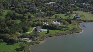 4K aerial stock footage of passing by waterfront mansions, Southampton, New York Aerial Stock Footage | AX91_212