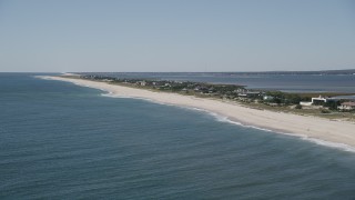 AX91_219 - 4K aerial stock footage of a row of mansions on the beach, Southampton, New York