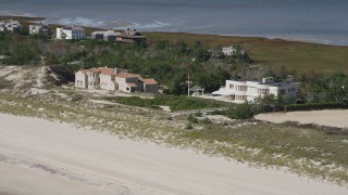 4K aerial stock footage of flying by two beachfront mansions, Southampton, New York Aerial Stock Footage | AX91_223