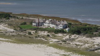 4K aerial stock footage of flying by an isolated beachfront mansion, Southampton, New York Aerial Stock Footage | AX91_225