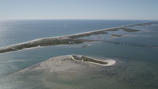 AX91_232 - 4K aerial stock footage pan across Ponquogue Bridge, beach, and tiny islands, Hampton Bays, New York