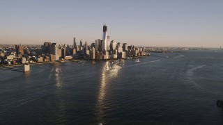 4K aerial stock footage of Lower Manhattan skyscrapers, from Hudson River, New York, New York, sunset Aerial Stock Footage | AX93_003