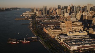 AX93_006 - 4K aerial stock footage Approaching West Side Yard, Chelsea, New York, New York, sunset