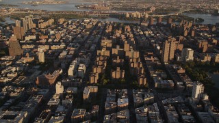 4K aerial stock footage Approaching public housing, tilt down, Harlem, New York, New York, sunset Aerial Stock Footage | AX93_019