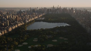 4K aerial stock footage Flying over Central Park, panning right, New York, New York, sunset Aerial Stock Footage | AX93_020