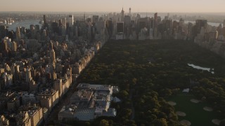 4K aerial stock footage Approaching Metropolitan Museum of Art, tilt down, New York, New York, sunset Aerial Stock Footage | AX93_023