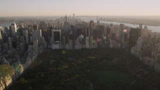 4K aerial stock footage Approaching Midtown Manhattan, from Central Park, New York, New York, sunset Aerial Stock Footage | AX93_025