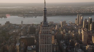 4K aerial stock footage Flying by the Empire State Building, Midtown Manhattan, New York, sunset Aerial Stock Footage | AX93_037