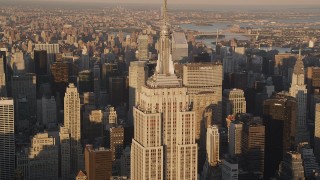 4K aerial stock footage Flying by the Empire State Building, Midtown Manhattan, New York, sunset Aerial Stock Footage | AX93_043