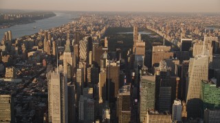 4K aerial stock footage Approaching Midtown Manhattan skyscrapers, New York, New York, sunset Aerial Stock Footage | AX93_045