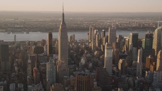 4K aerial stock footage Flying by the Empire State Building, Midtown Manhattan, New York, sunset Aerial Stock Footage | AX93_053