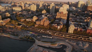 4K aerial stock footage Panning left by traffic, Brooklyn Queens Freeway, Brooklyn, New York, New York, sunset Aerial Stock Footage | AX93_079