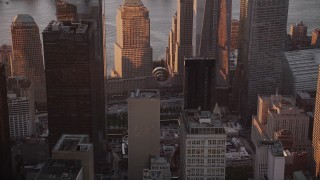 4K aerial stock footage Tilting up One World Trade Center, Lower Manhattan, New York, New York, sunset Aerial Stock Footage | AX93_093