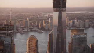 4K aerial stock footage Tilt to the top of One World Trade Center, Lower Manhattan, New York, sunset Aerial Stock Footage | AX93_094