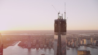 4K aerial stock footage of One World Trade Center, reveal World Trade Center Memorial, New York, sunset Aerial Stock Footage | AX93_095