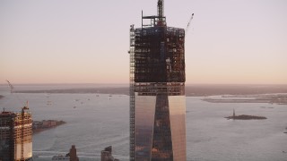 4K aerial stock footage Tilting down One World Trade Center, Lower Manhattan, New York, New York, sunset Aerial Stock Footage | AX93_098