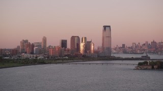 4K aerial stock footage Flying by Goldman Sachs Tower, Downtown skyline, Jersey City, New Jersey, sunset Aerial Stock Footage | AX93_117