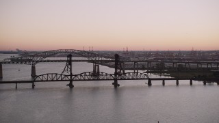 4K aerial stock footage of Newark Bay Bridge, Lehigh Valley Railroad Bridge, Newark Bay, Newark, New Jersey, twilight Aerial Stock Footage | AX93_128