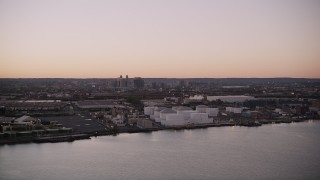 AX93_129 - 4K aerial stock footage Flying by an oil refinery, Newark Bay, Newark, New Jersey, twilight