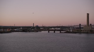 4K aerial stock footage Approaching an oil refinery, factory, Passaic River, Newark, New Jersey, twilight Aerial Stock Footage | AX93_130