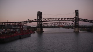 AX93_133 - 4K aerial stock footage of Lincoln Highway Bridge, Pulaski Skyway Bridge, Newark, New Jersey, twilight