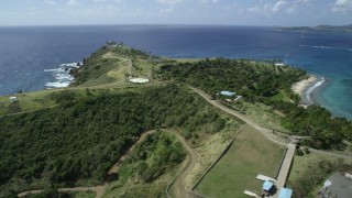 AX96_159 - 5k stock footage aerial stock footage fly over island to approach gold-domed building on Little St James Island, St Thomas, Virgin Islands