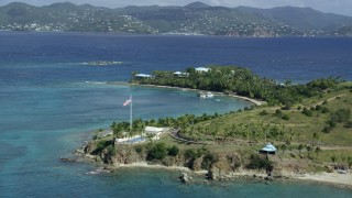 5k stock footage aerial stock footage orbit American flag and pool area on Little St James Island, St Thomas, Virgin Islands Aerial Stock Footage | AX96_161