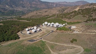 AXSF01_005 - 5K aerial stock footage Flyby hilltop satellite dishes in Fillmore, California