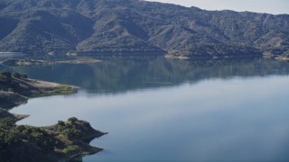 5K aerial stock footage Flying low over grassy hill, revealing Lake Casitas, Ventura, California Aerial Stock Footage | AXSF01_017