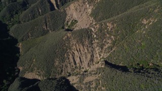 AXSF01_027 - 5K aerial stock footage of bird's eye view flying over scarred mountainside, Santa Ynez Mountains, California