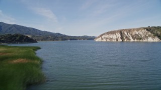 AXSF01_042 - 5K aerial stock footage Flying low over Lake Cachuma, arid mountains, Santa Barbara County, California