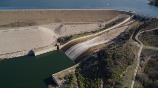 AXSF01_046 - 5K aerial stock footage of flying by Bradbury Dam at Lake Cachuma, California