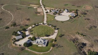 AXSF01_048 - 5K aerial stock footage of approaching an isolated ranch house in Santa Ynez, California