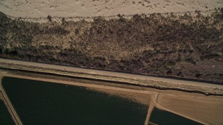 AXSF02_009 - 5K aerial stock footage of bird's eye view of fields of crops, reveal dry riverbed, Santa Maria, California