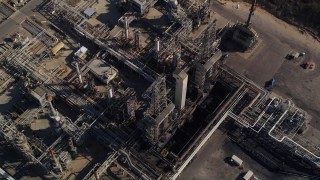 AXSF02_018 - 5K aerial stock footage tilt to bird's eye of flare stacks and structures at Phillips 66 Company Santa Maria Refinery, Arroyo Grande, California