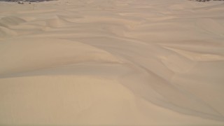 AXSF02_023 - 5K aerial stock footage of flying over sand dunes, Pismo Dunes, California