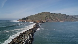 AXSF02_044 - 5K aerial stock footage pan across San Luis Obispo Bay, approach lighthouse, San Luis Obispo, California