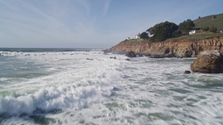 5K aerial stock footage fly over crashing waves and ascend over lighthouse on cliffs, San Luis Obispo, California Aerial Stock Footage | AXSF02_045