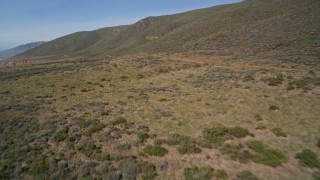 5K aerial stock footage of flying by a dirt road along the coast, Avila Beach, California Aerial Stock Footage | AXSF02_046