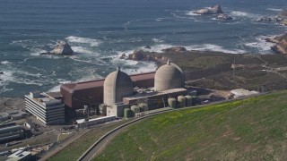 AXSF02_057 - 5K aerial stock footage of flying by the coastal Diablo Canyon Power Plant, Avila Beach, California