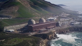 AXSF02_058 - 5K aerial stock footage of orbiting the coastal Diablo Canyon Power Plant, Avila Beach, California