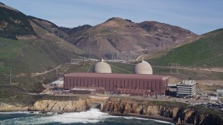 AXSF02_059 - 5K aerial stock footage of flying by the coastal Diablo Canyon Power Plant, Avila Beach, California