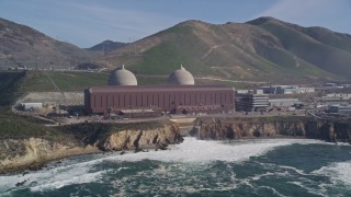 AXSF02_061 - 5K aerial stock footage flyby Diablo Canyon Power Plant nuclear facility, seen from the ocean, Avila Beach, California