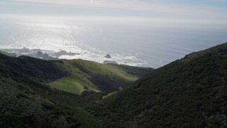 AXSF02_063 - 5K aerial stock footage flyby hill near the Diablo Canyon Power Plant nuclear facility, Avila Beach, California