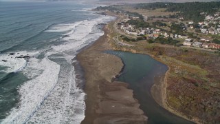 5K aerial stock footage tilt from oceanfront homes to reveal Moon Stone Beach, Cambria, California Aerial Stock Footage | AXSF03_028