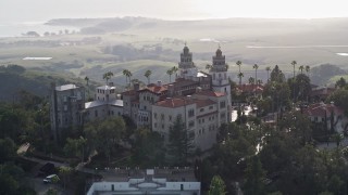 5K aerial stock footage of flying by the east and north side of historic Hearst Castle, San Simeon, California Aerial Stock Footage | AXSF03_049