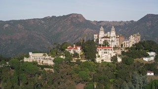 AXSF03_050 - 5K aerial stock footage of orbiting the Neptune Pool, west side of iconic Hearst Castle, San Simeon, California