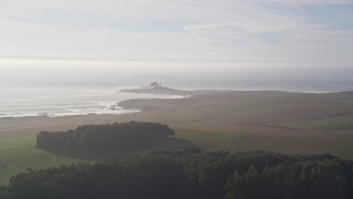 5K aerial stock footage approach Piedras Blancas Light Station on Point Piedras Blancas, California Aerial Stock Footage | AXSF03_052