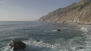 5K aerial stock footage fly over rock formations by coastal cliffs, Big Sur, California Aerial Stock Footage | AXSF03_098